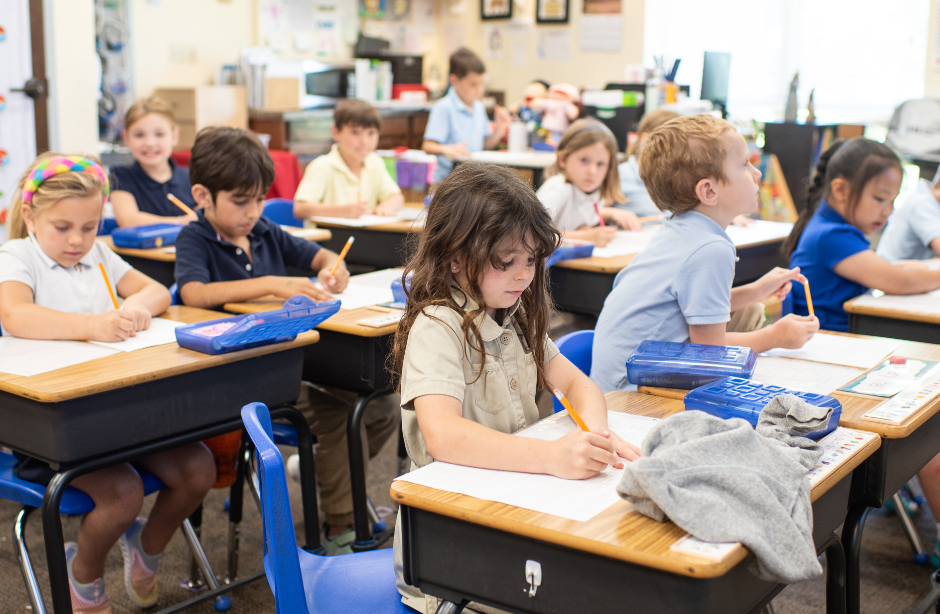 Holy Trinity Elementary selective focal photo of crayons in yellow box